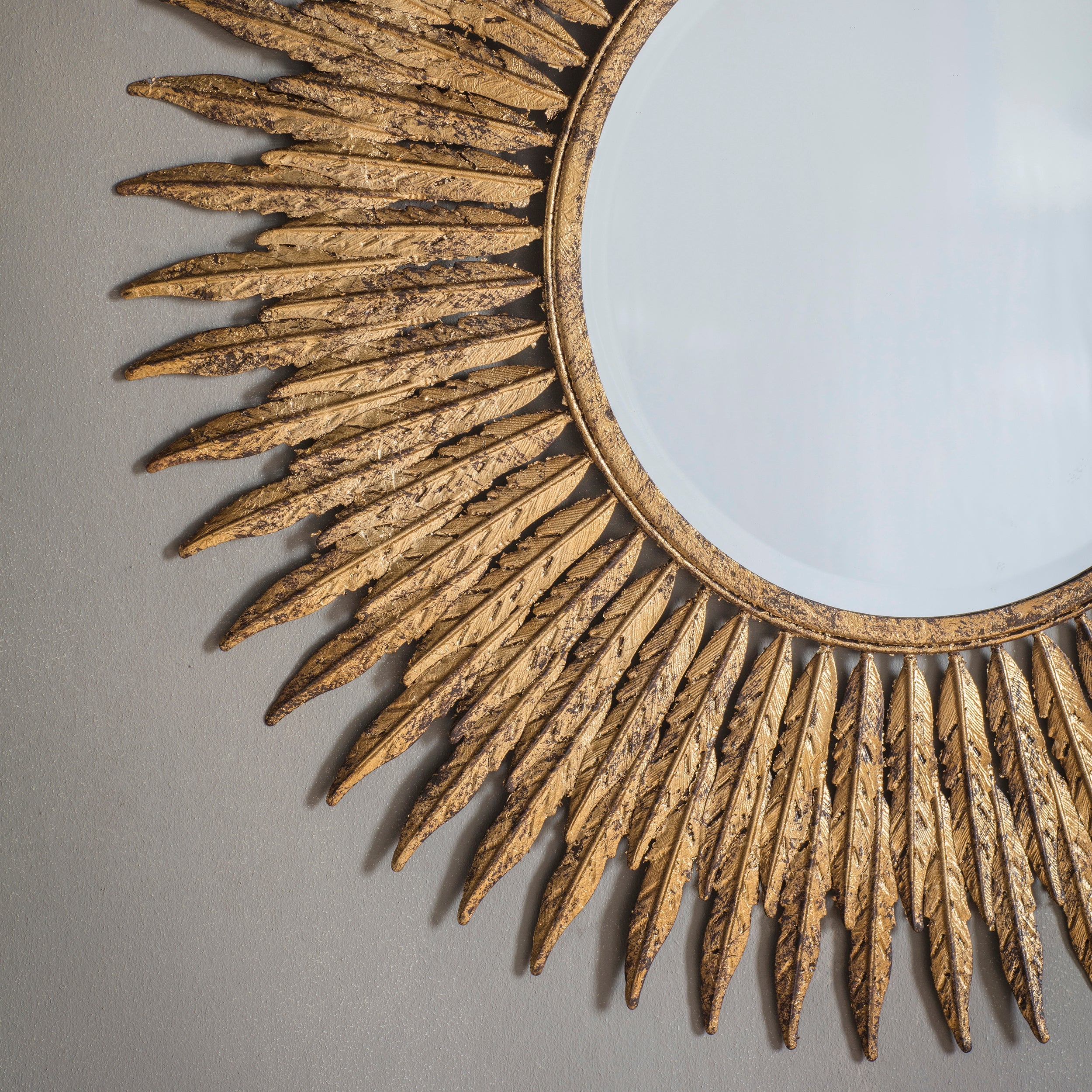 Amos Aged gold feathered frame round mirror