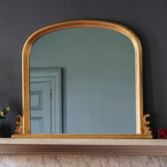 Amos Gold leaf arch over mantel mirror