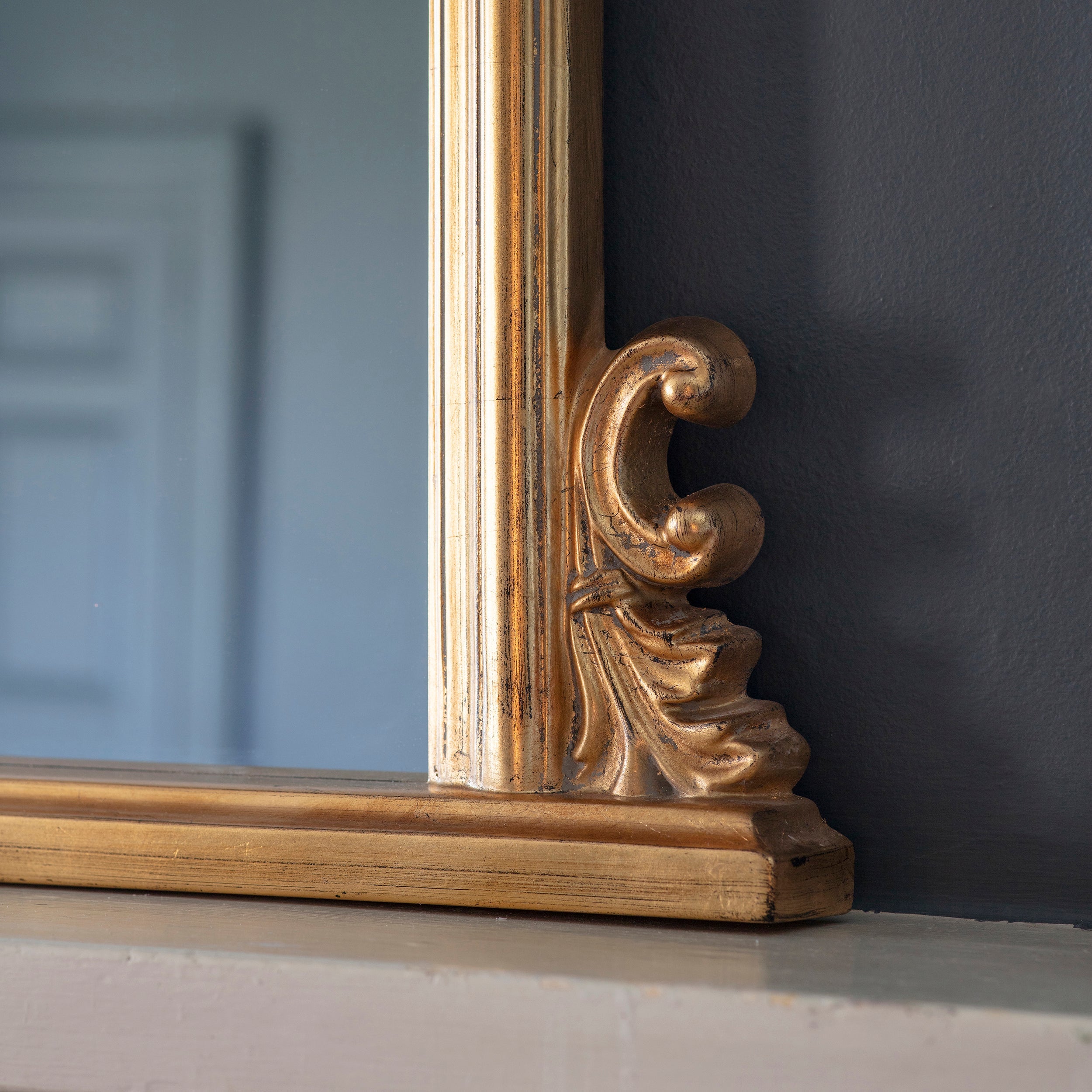Amos Gold leaf arch over mantel mirror