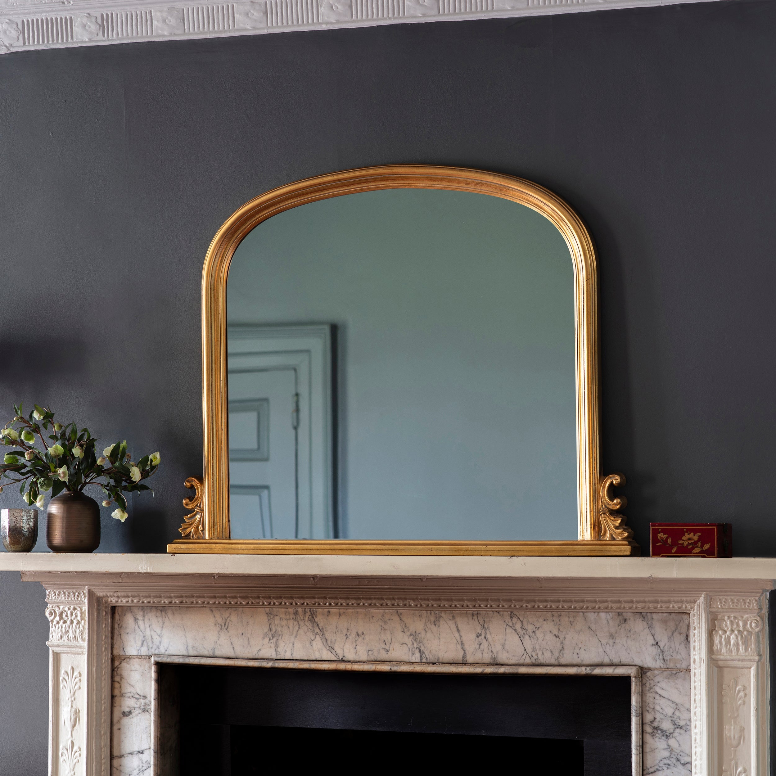 Amos Gold leaf arch over mantel mirror